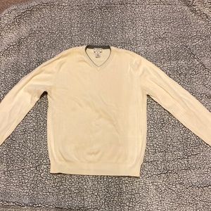 Covington off-white sweater with grey trim collar.
